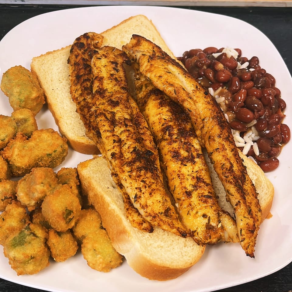 Lutfi’s Raymore seafood platter with fried fish, fried okra, white bread, and red beans and rice.